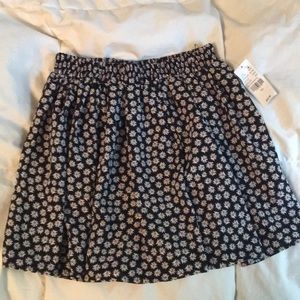 Black daisy print mini skirt